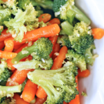 Delicious steamed Broccoli and Carrots with Garlic and Olive Oil - perfectly steamed broccoli and carrots with a touch of olive oil and garlic.