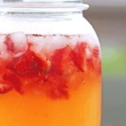 Easy, delicious wine cocktail made with honey, strawberries, lemon juice & Moscato wine. This wine cocktail is perfect for summer gatherings.