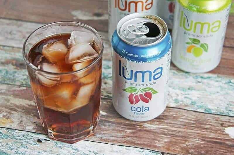a can of cola Luma Soda next to a glass