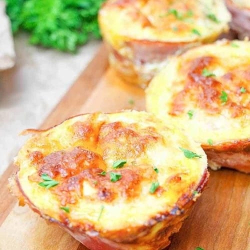These low carb breakfast egg muffins are super easy to make and so delicious! Stuffed with yummy sausage gravy. Perfect to make ahead & reheat each morning for low carb & ketogenic diets.
