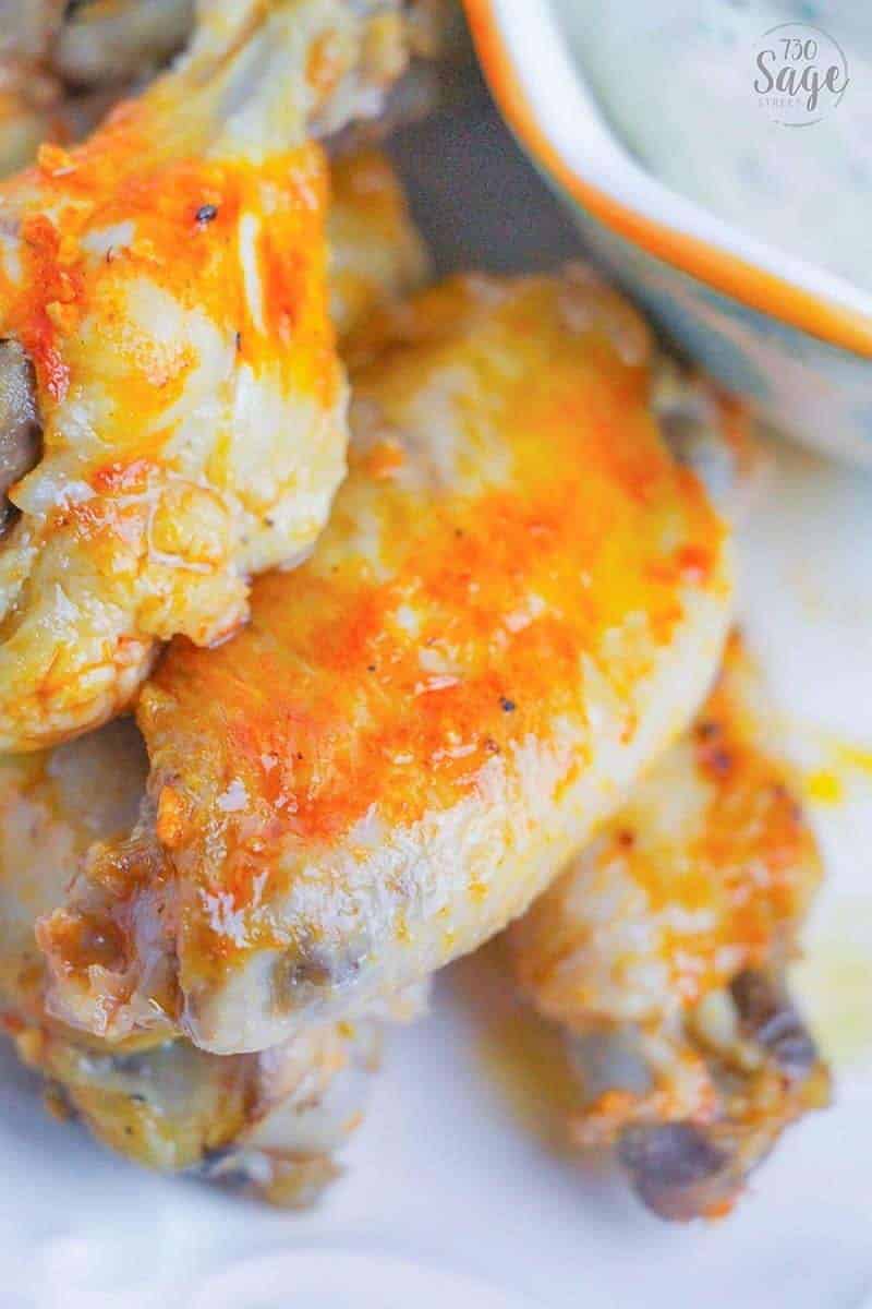 Spicy wings dipped in cool ranch is so satisfying & this low carb instant pot hot wings recipe means you can enjoy quick and easy hot wings even if you follow a ketogenic or low carb diet.