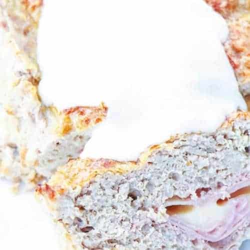 This low carb chicken cordon bleu meatloaf takes meatloaf to the next level by using ground chicken and stuffing it with ham and cheese and slathering it in a creamy sauce. Perfect keto dinner for the whole family!