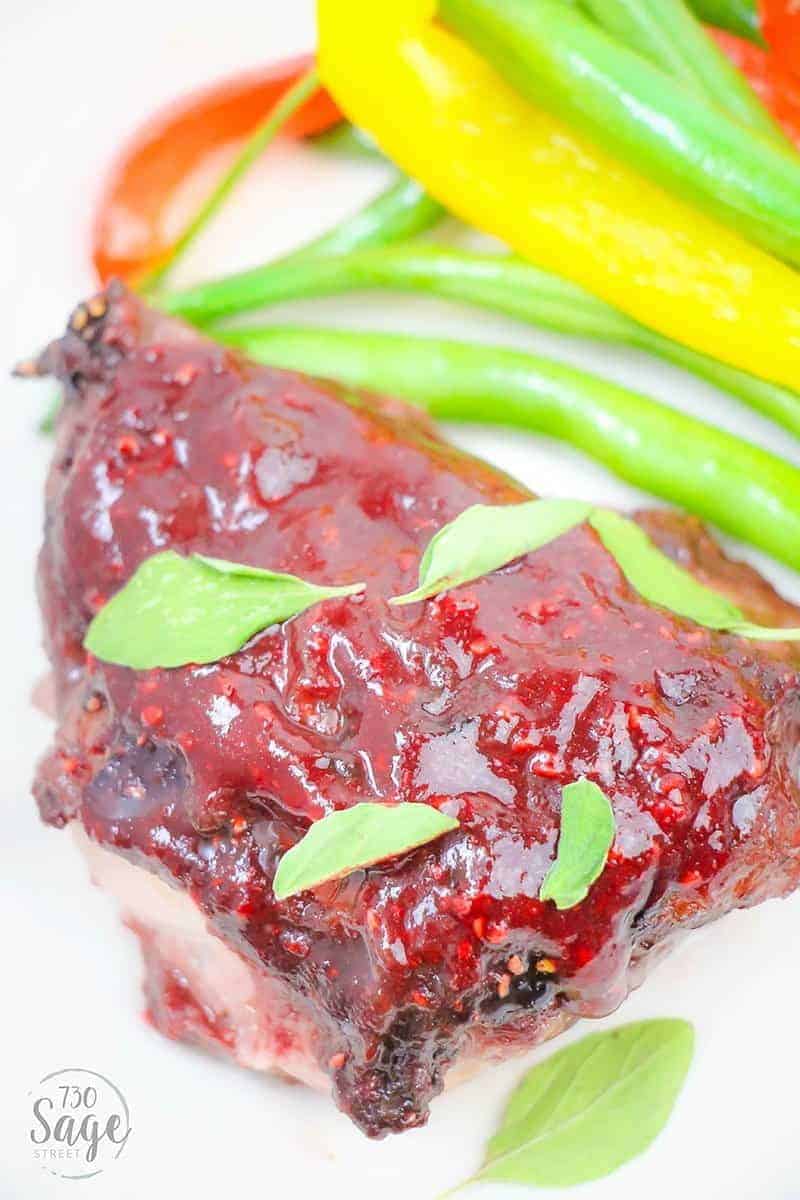 This low carb raspberry chicken will shake up your keto recipe routine with a delicious sweet & savory raspberry marinade over boneless chicken thighs.