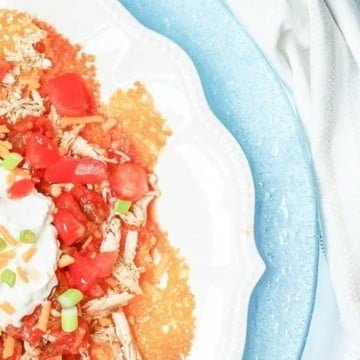 Keto Nachos - Slow Cooker Chicken Low Carb Nachos 8 keto nachos - low carb nachos close up with sour cream on a blue plate