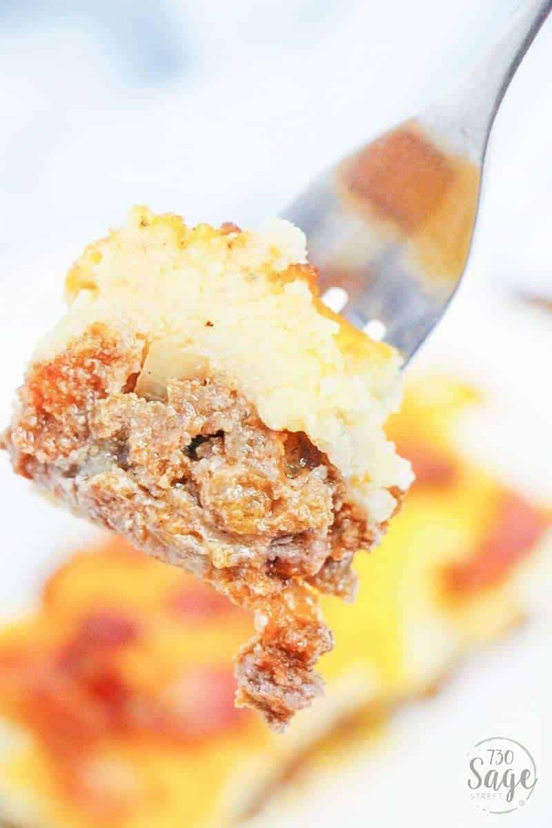 Cauliflower Casserole - Low Carb Beef And Cheese Cauliflower Casserole 4 A bite of a loaded cauliflower casserole on a fork.