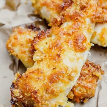 baked chicken tenders on parchment paper