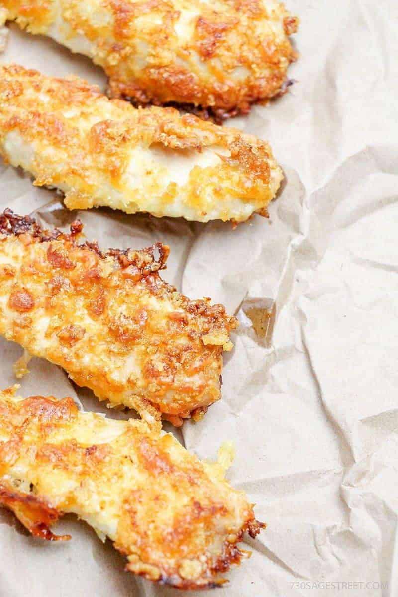 baked chicken tenders on parchment paper