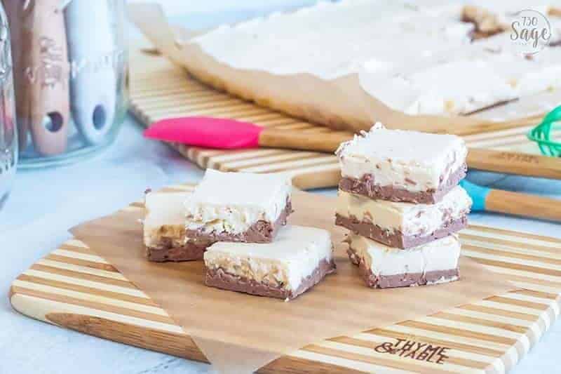 pieces of keto fudge stacked on a cutting board