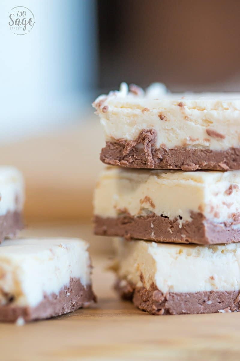 3 pieces of brown and white keto fudge stacked on top of each other