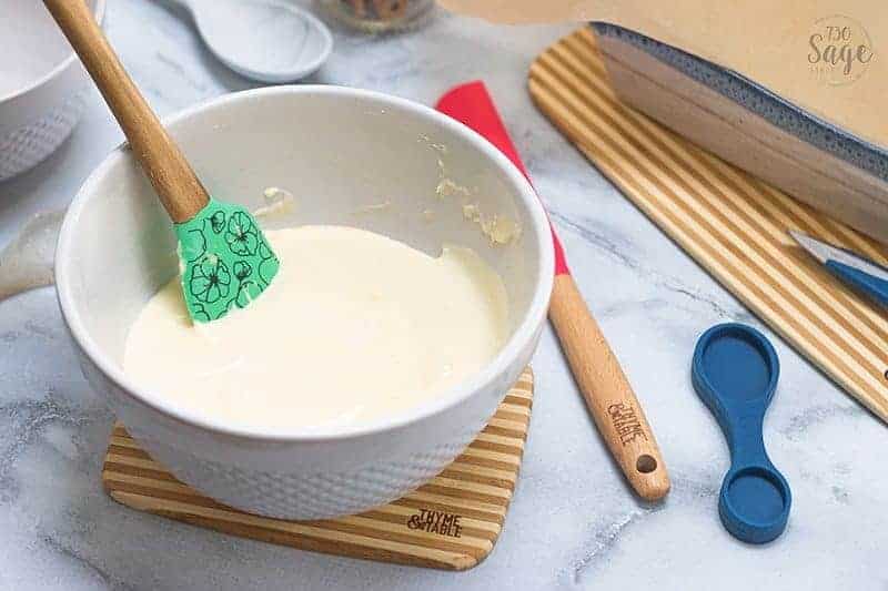 white mixing bowl with white fudge