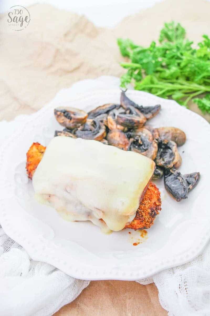 Malibu Chicken - Easy Low Carb Recipe 5 Low carb malibu chicken on a white plate with mushrooms and dipping sauce