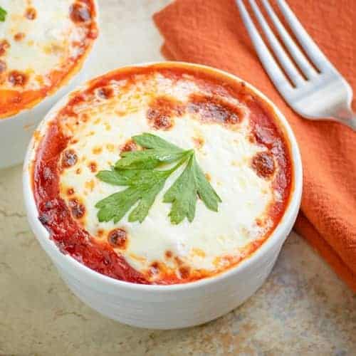 close up of low carb lasagna in a white bowl