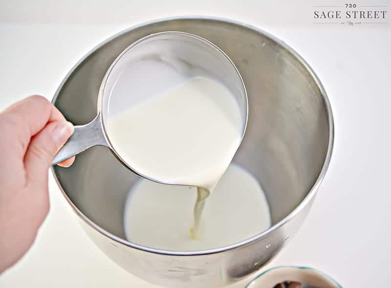 heavy cream being poured into a bowl