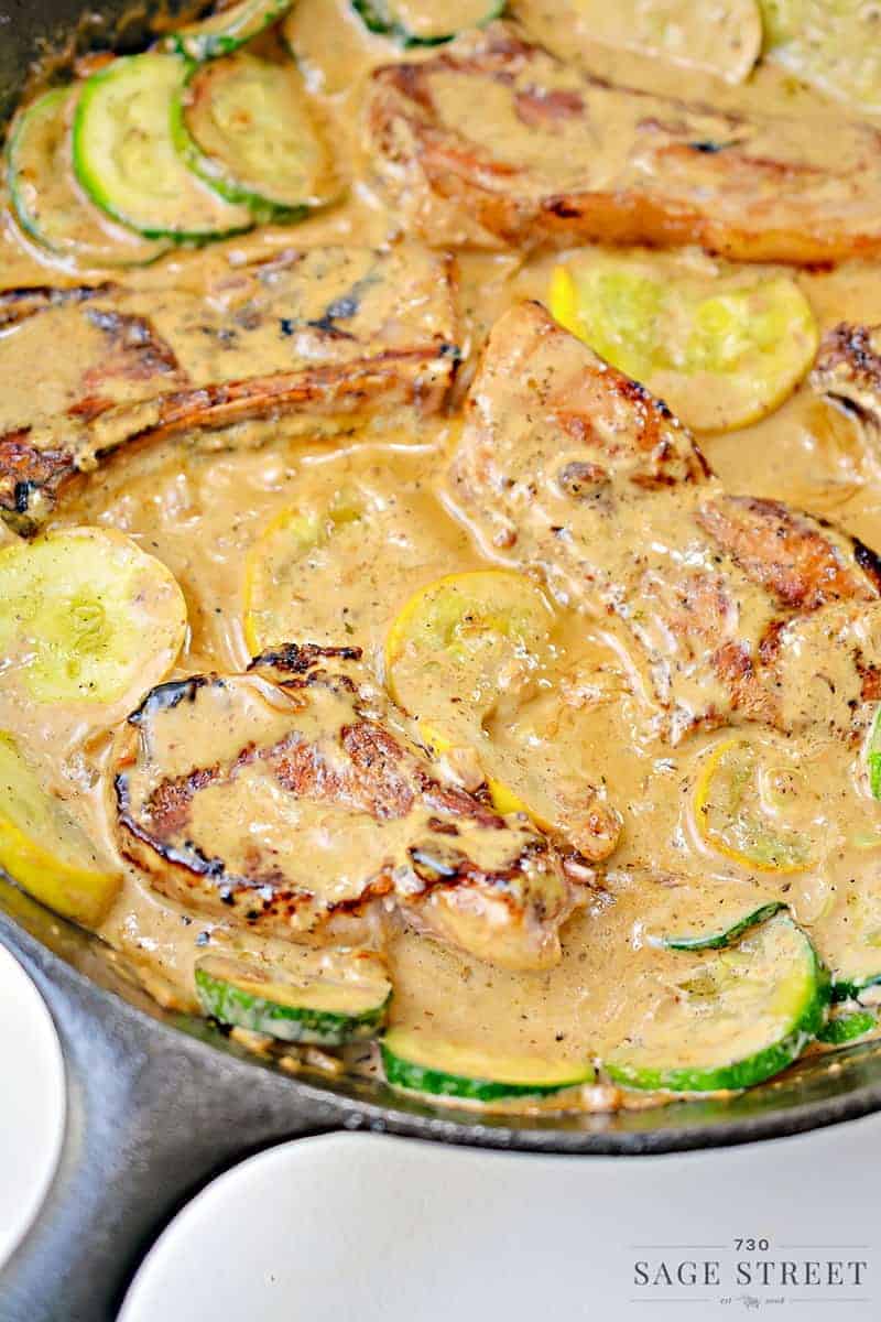 keto creamy mustard pork chops in a cast iron pan