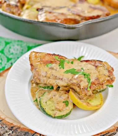 keto creamy mustard pork chops on a white plate