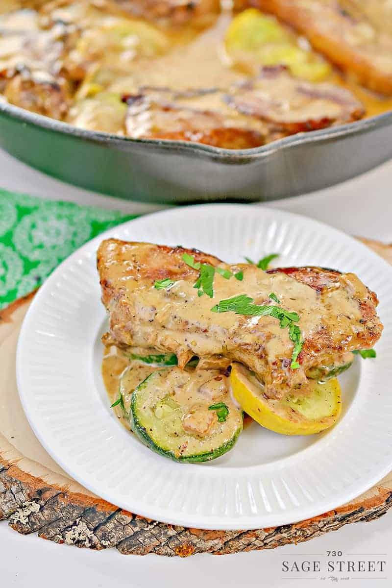 keto creamy mustard pork chops on a white plate