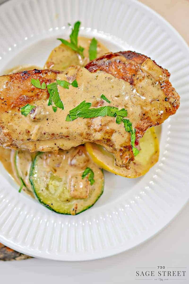 keto creamy mustard pork chops on a white plate