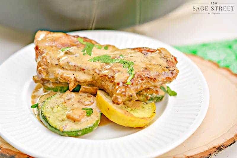 Keto Creamy Mustard Pork Chops with Sauteed Vegetables 1 keto mustard pork chops on veggies on a white plate