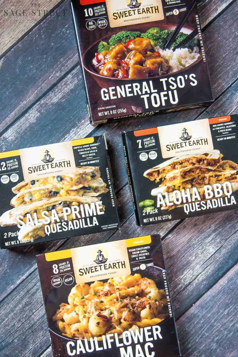 a variety of Sweet Earth Foods product packages on a wood background