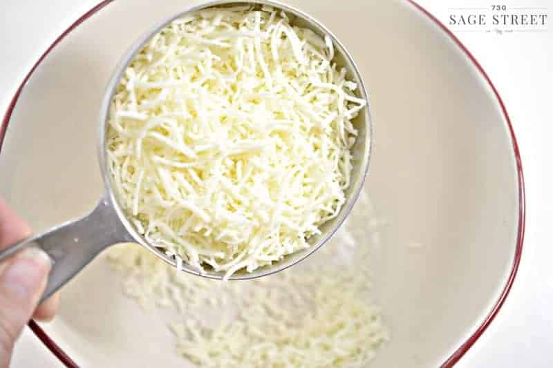 shredded cheese in a measuring cup