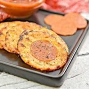 keto cheese crisps on a black plate