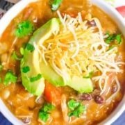 top view of enchilada soup in a white bowl