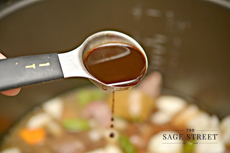 Making low carb beef stew recipe adding Worcestershire sauce