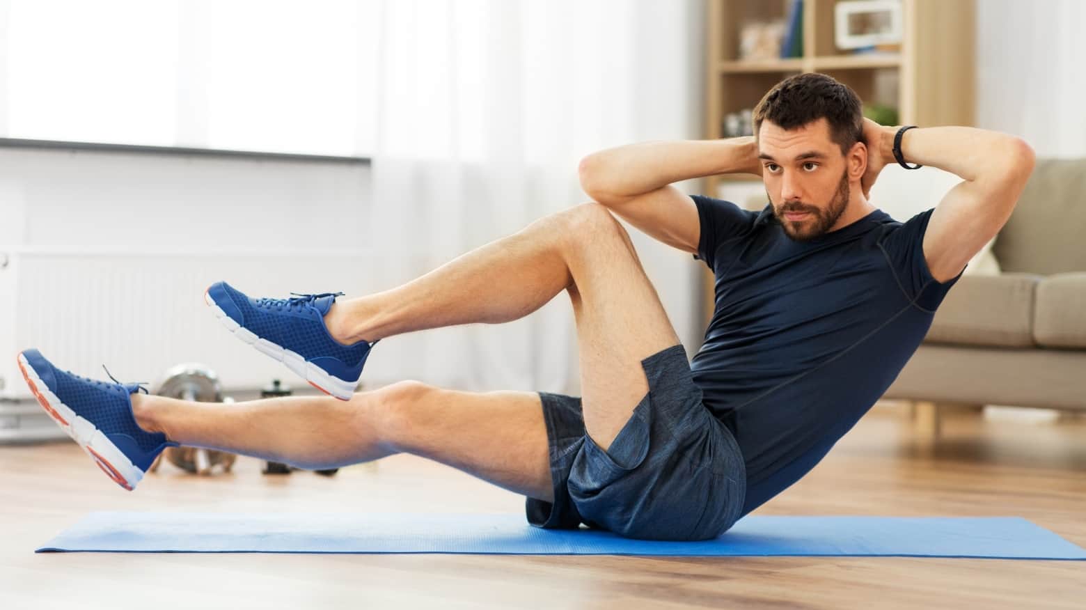 Spell Your Name Workout For Adults 2 Middle aged man doing crunches on yoga matt