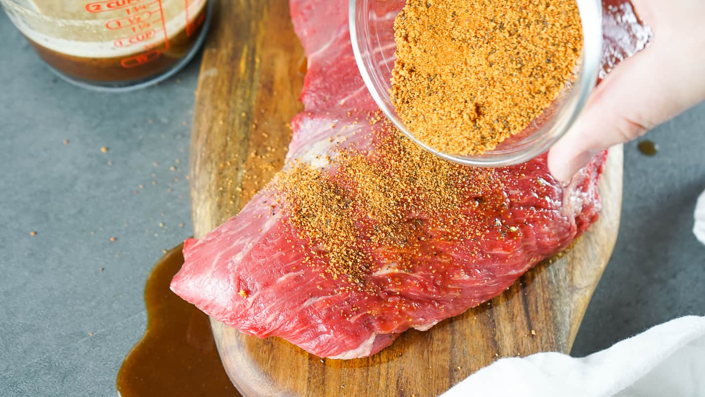 Smother the tri-tip in your favorite BBQ rub or try mine below, ensuring the rub covers every part of the meat.