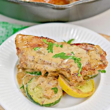 Pan Seared Pork Chops with zucchini slices and creamy topping