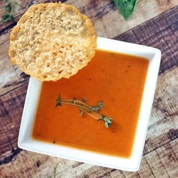 bowl of keto tomato soup with cheese crisps