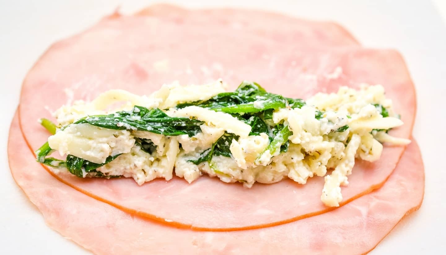 lay out two slices ham with cheese and spinach filling