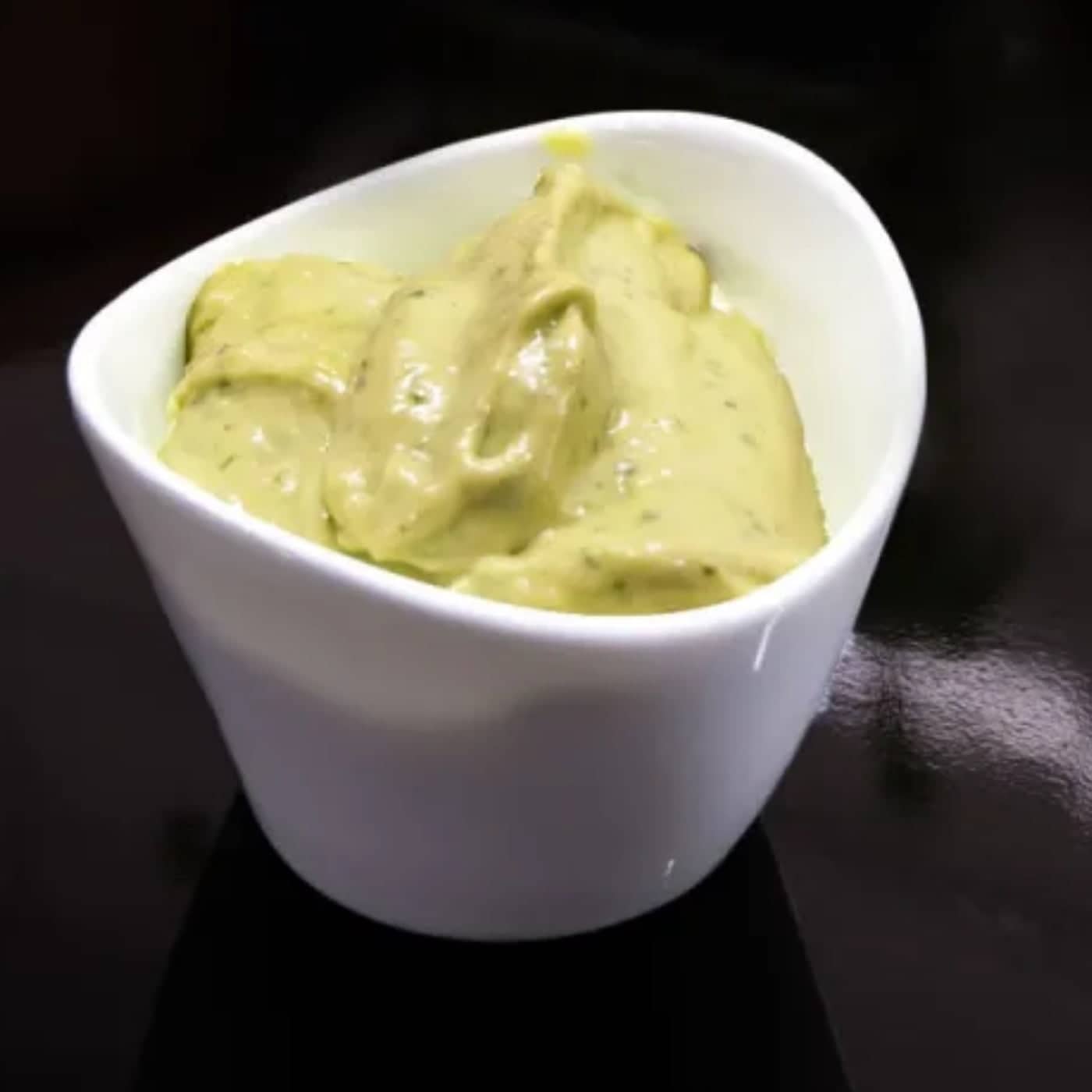 basil and parmesan mayonnaise in white bowl