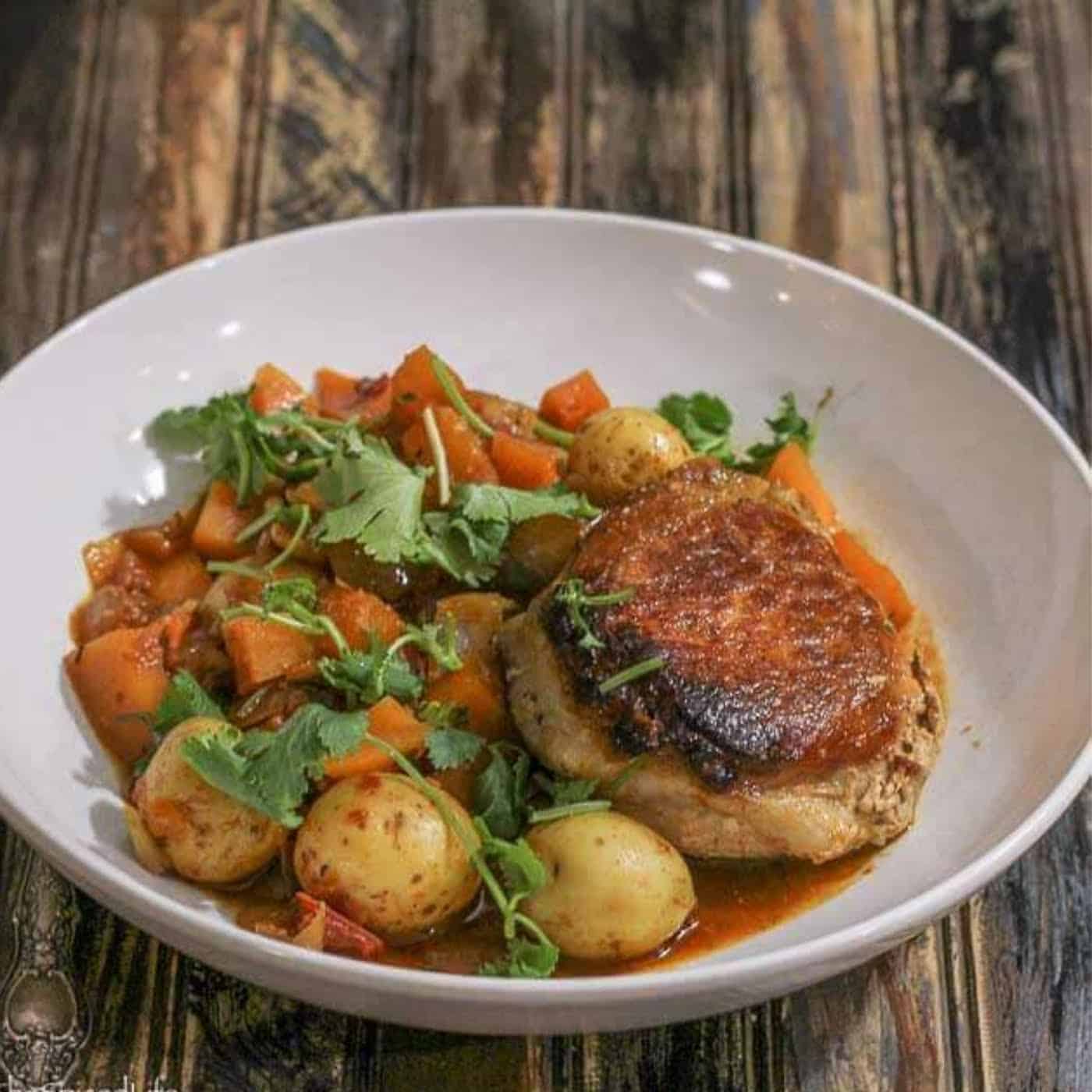 Mexican citrus drenched pork chops over butternut squash and potatoes