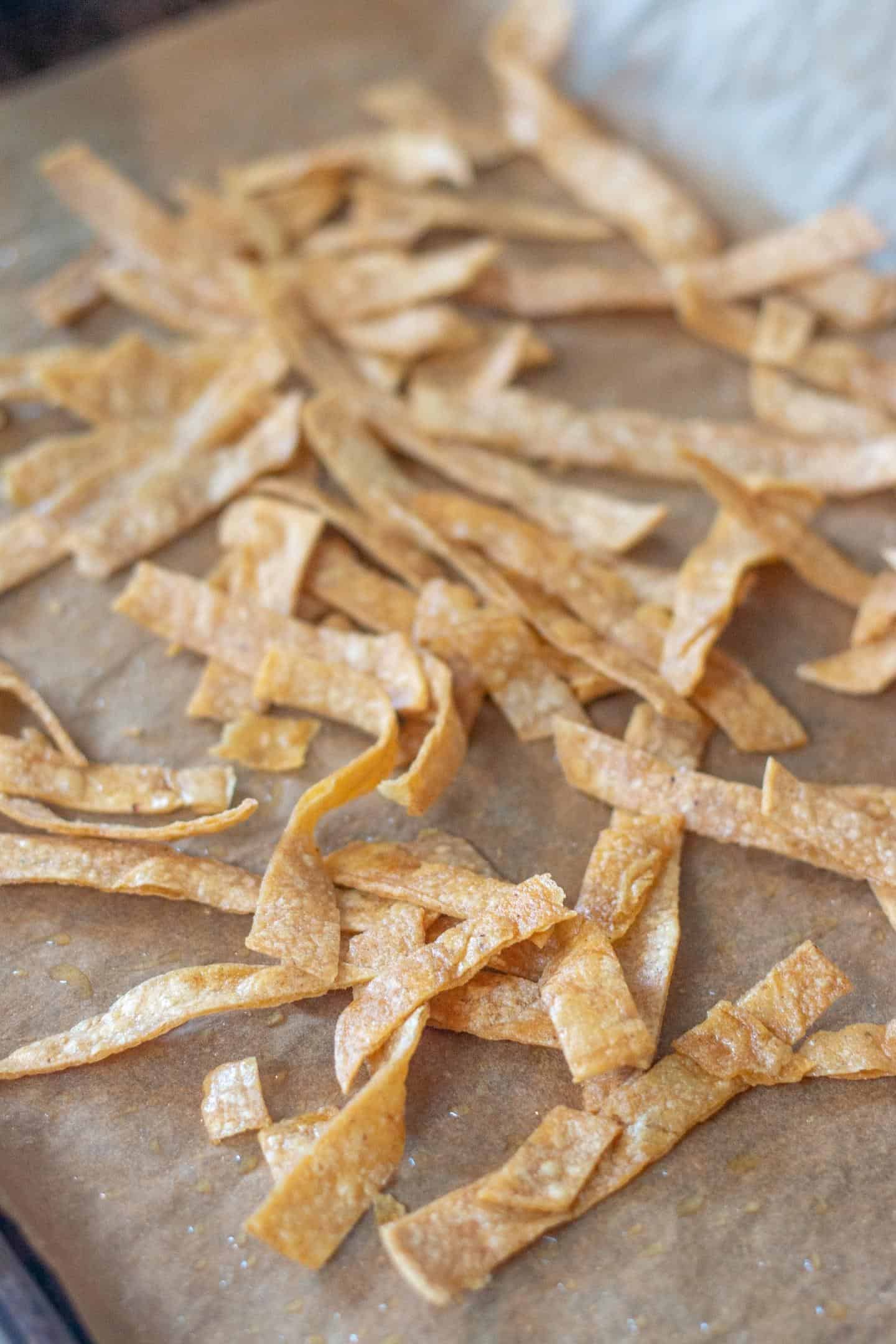 baked tortilla strips in a baking pan