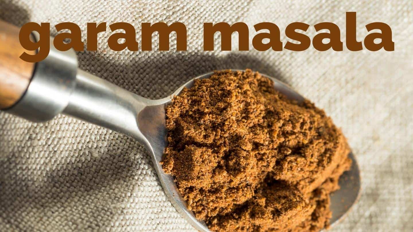 ground garam masala in a spoon