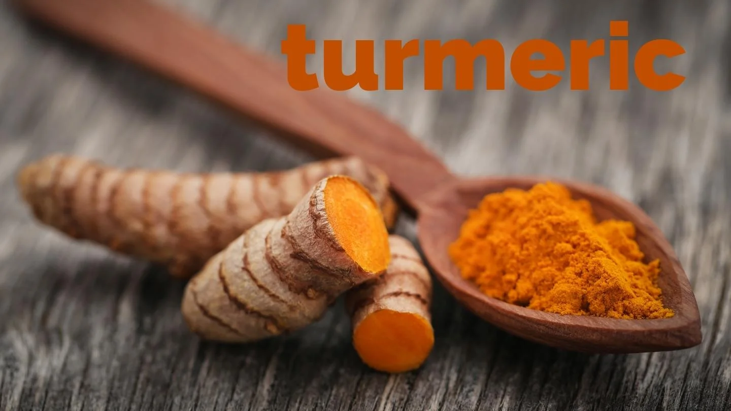 ground turmeric in a spoon