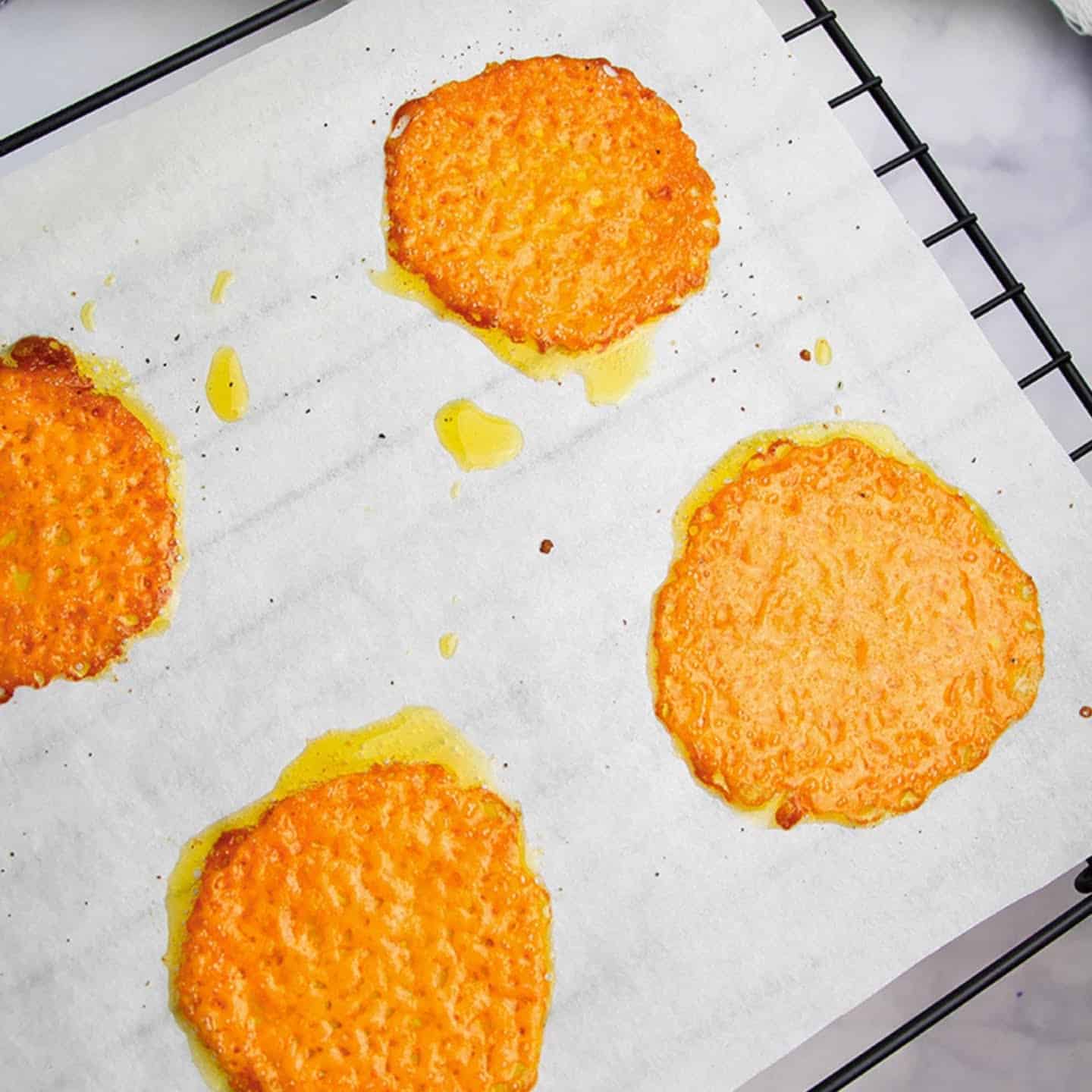 cheddar garlic cheese crisps on a rack