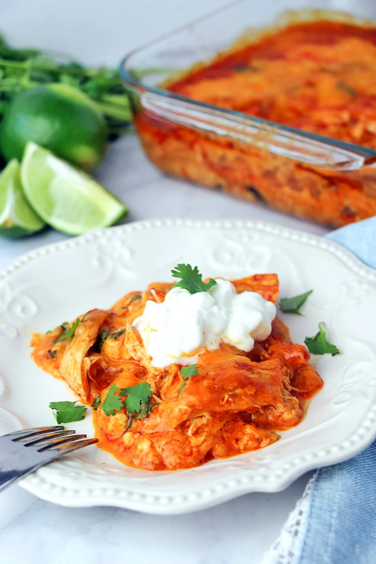 Chicken enchilada casserole  with sour cream on top 