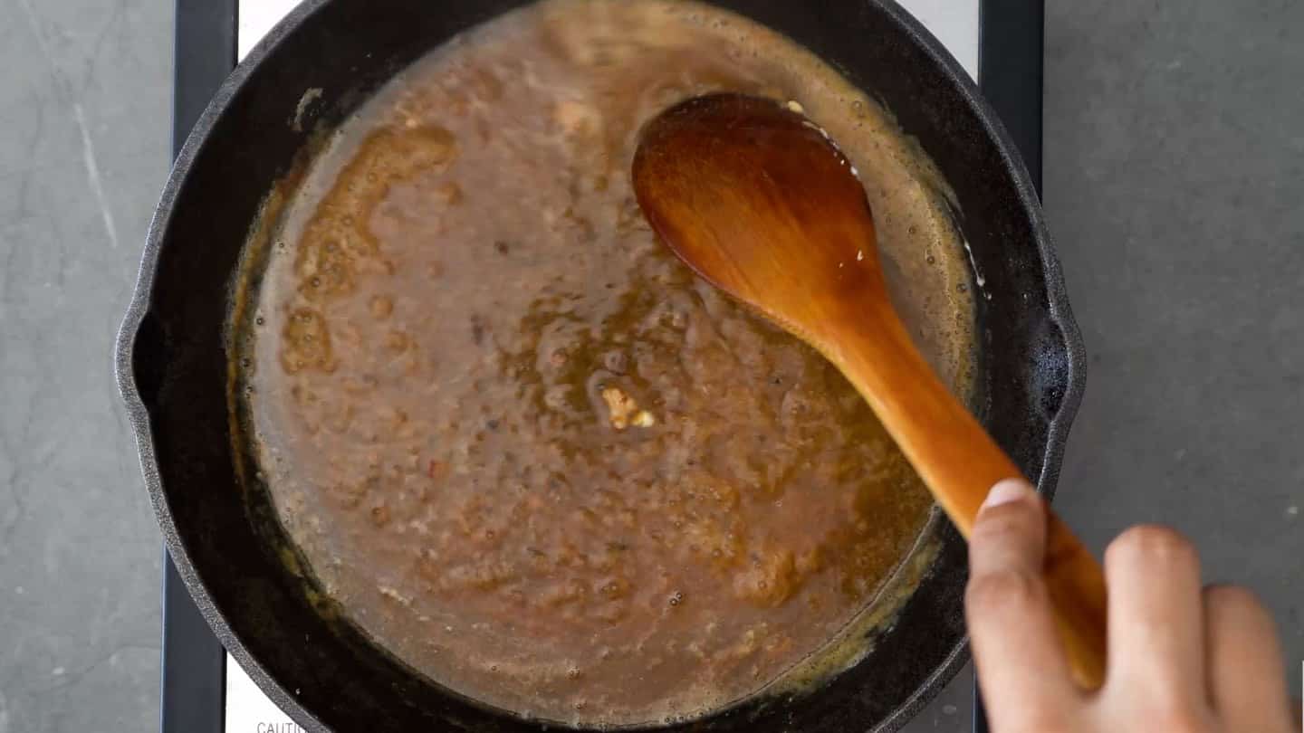 pour in the chicken stock. You'll need this to deglaze the skillet