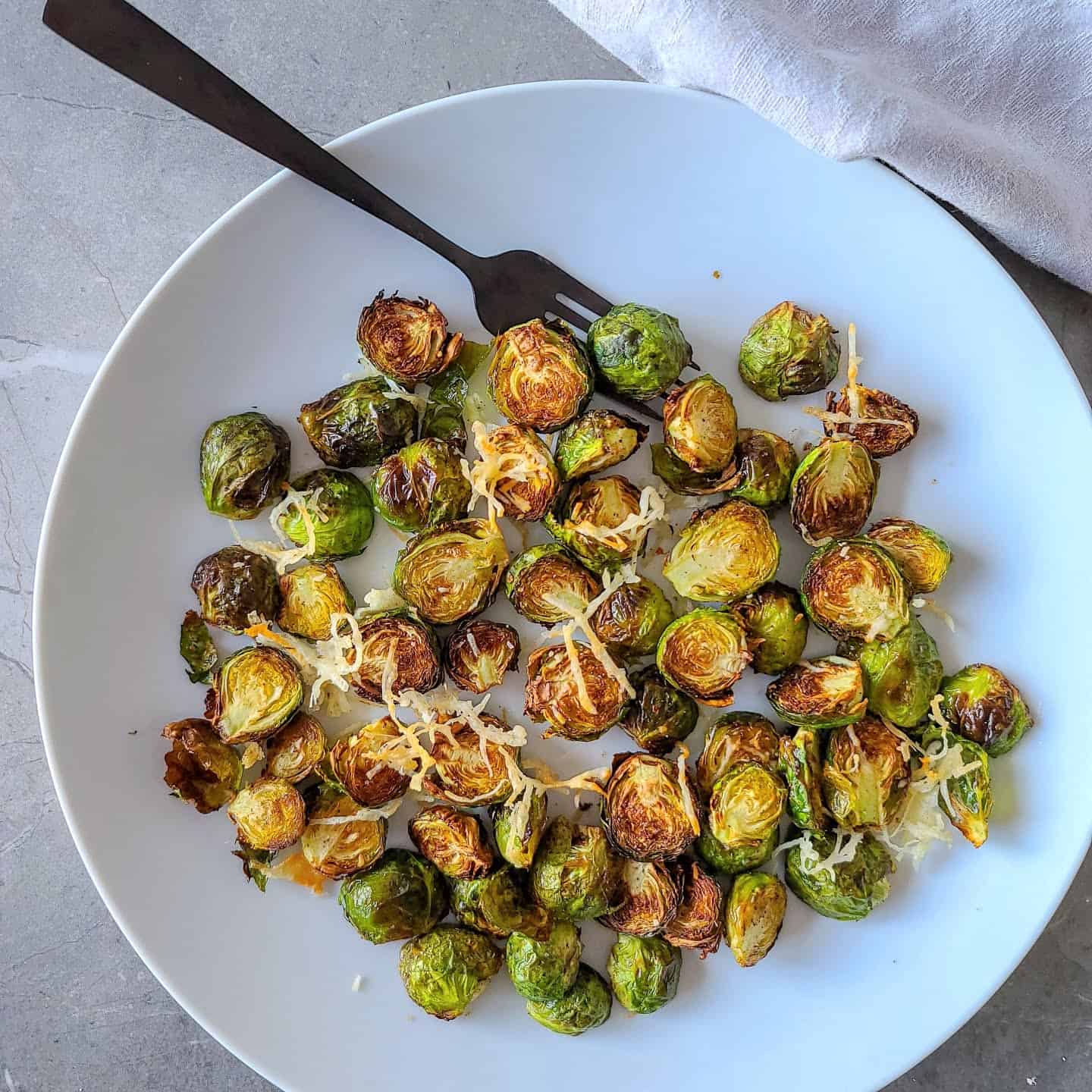 Air Fryer Brussel Sprouts with parmesan served on a plate