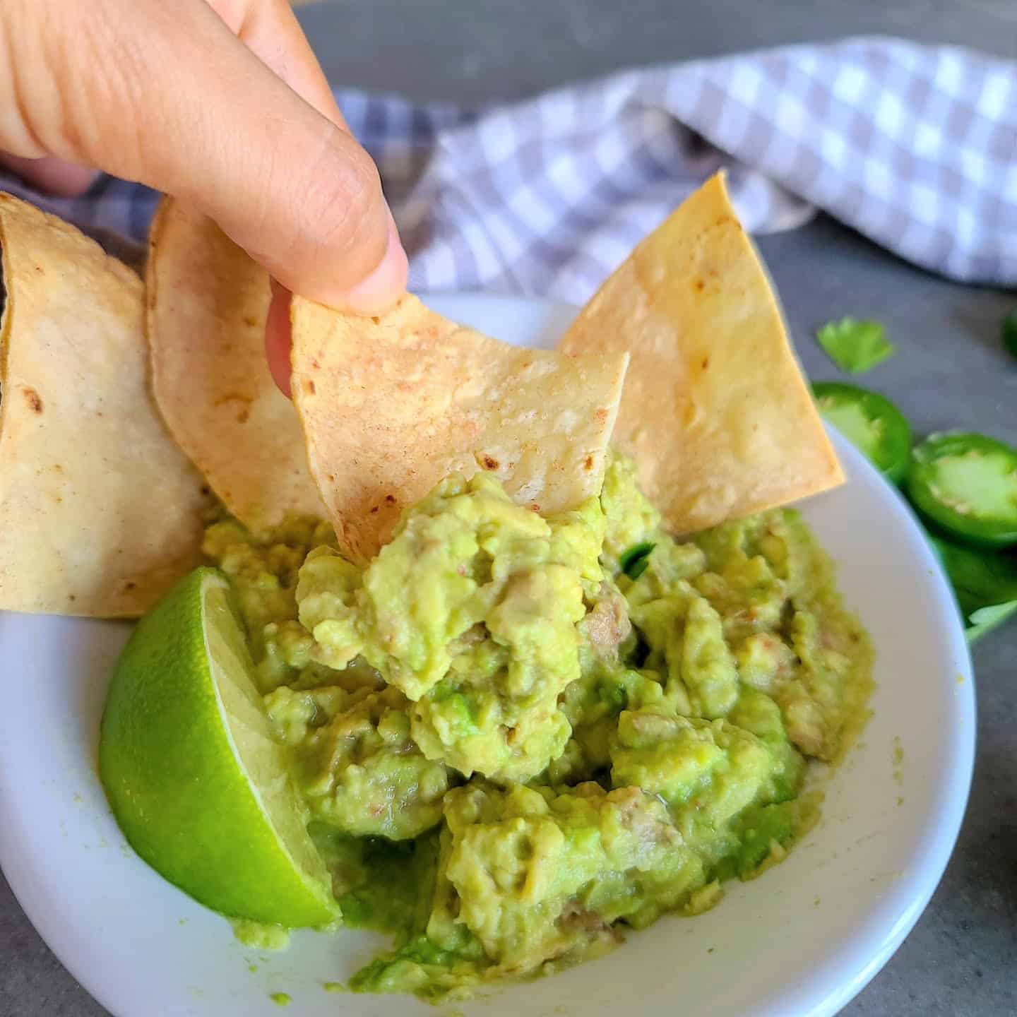 tortillas chips in a air fryer with guacamole