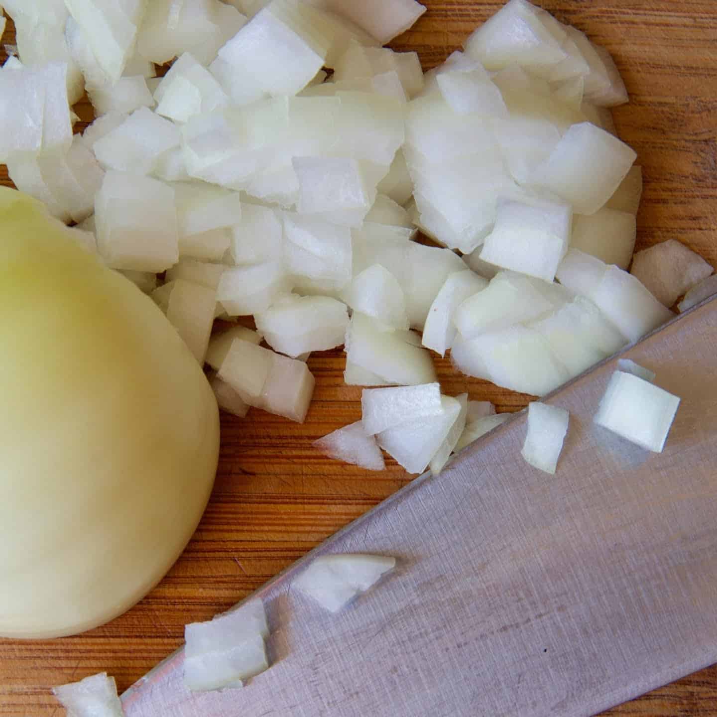 Chopping an onion finely