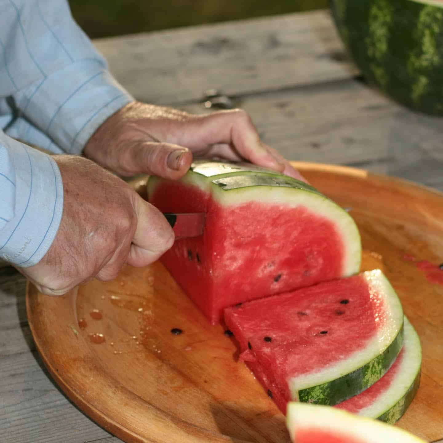 Cutting a watermelon into wedge slices