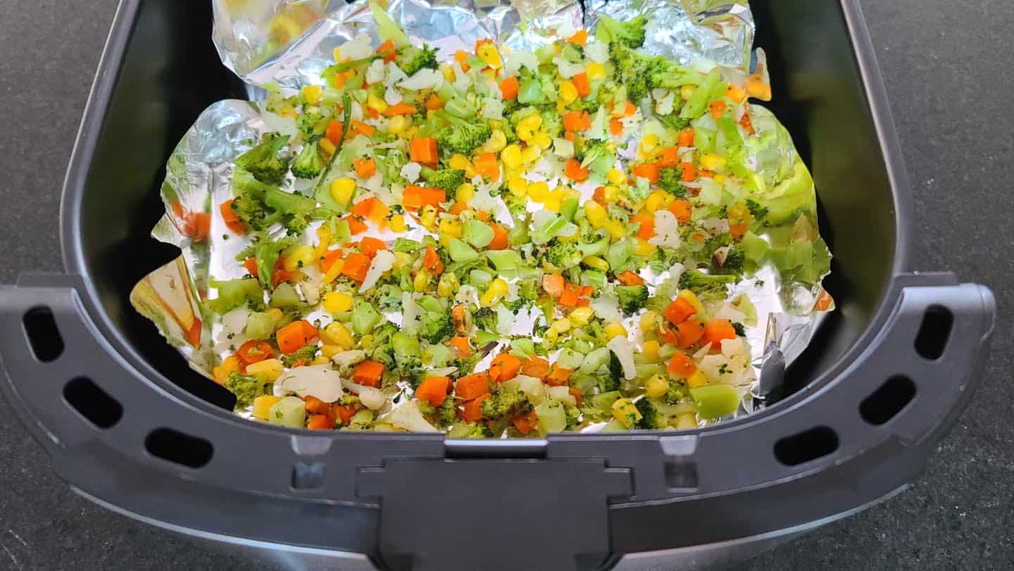 vegetables in an air fryer with tin foil