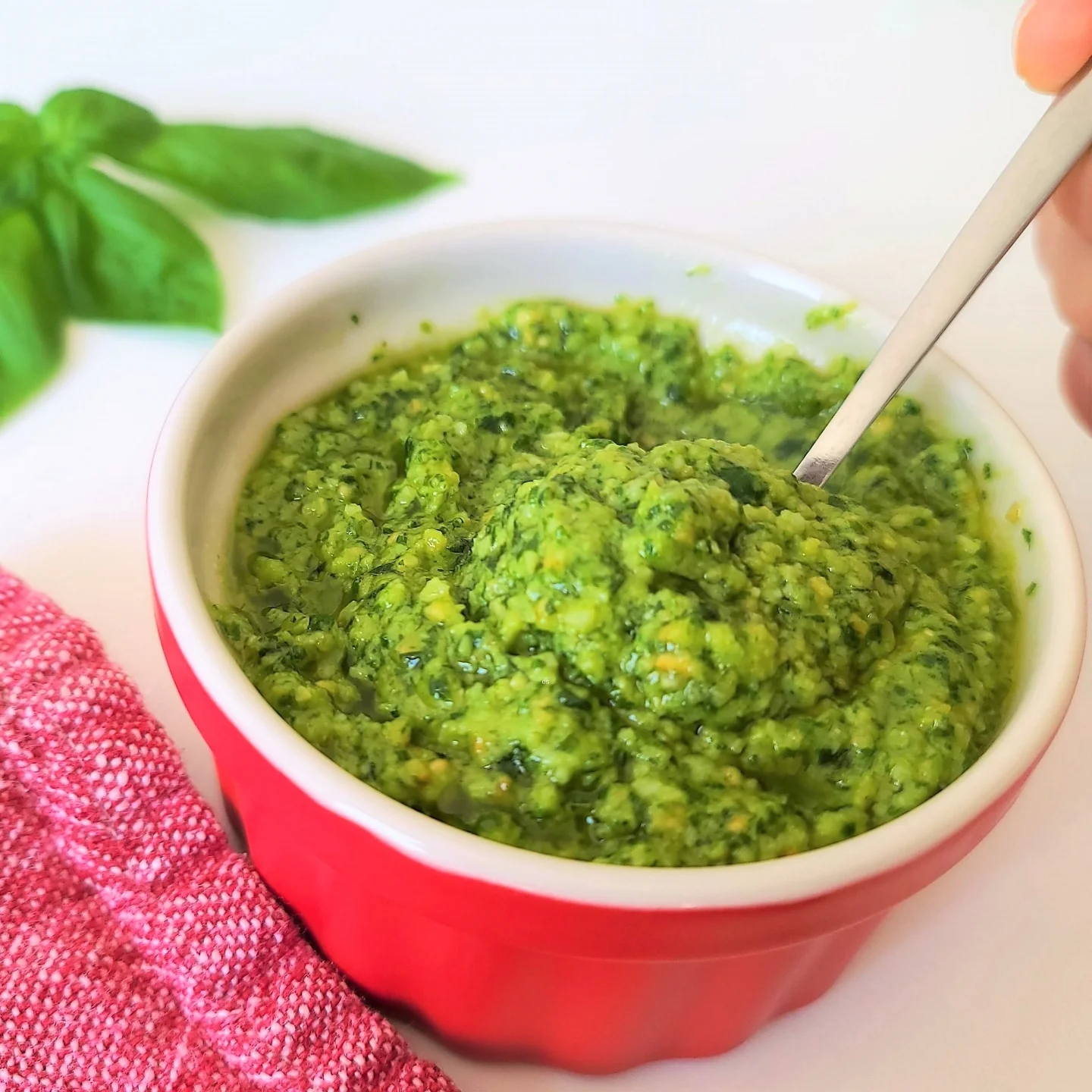 almond pesto in a red bowl