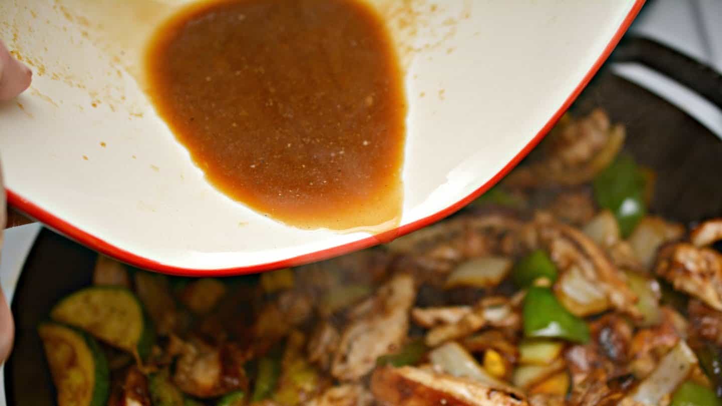 chicken and vegetables together with the reserved marinade