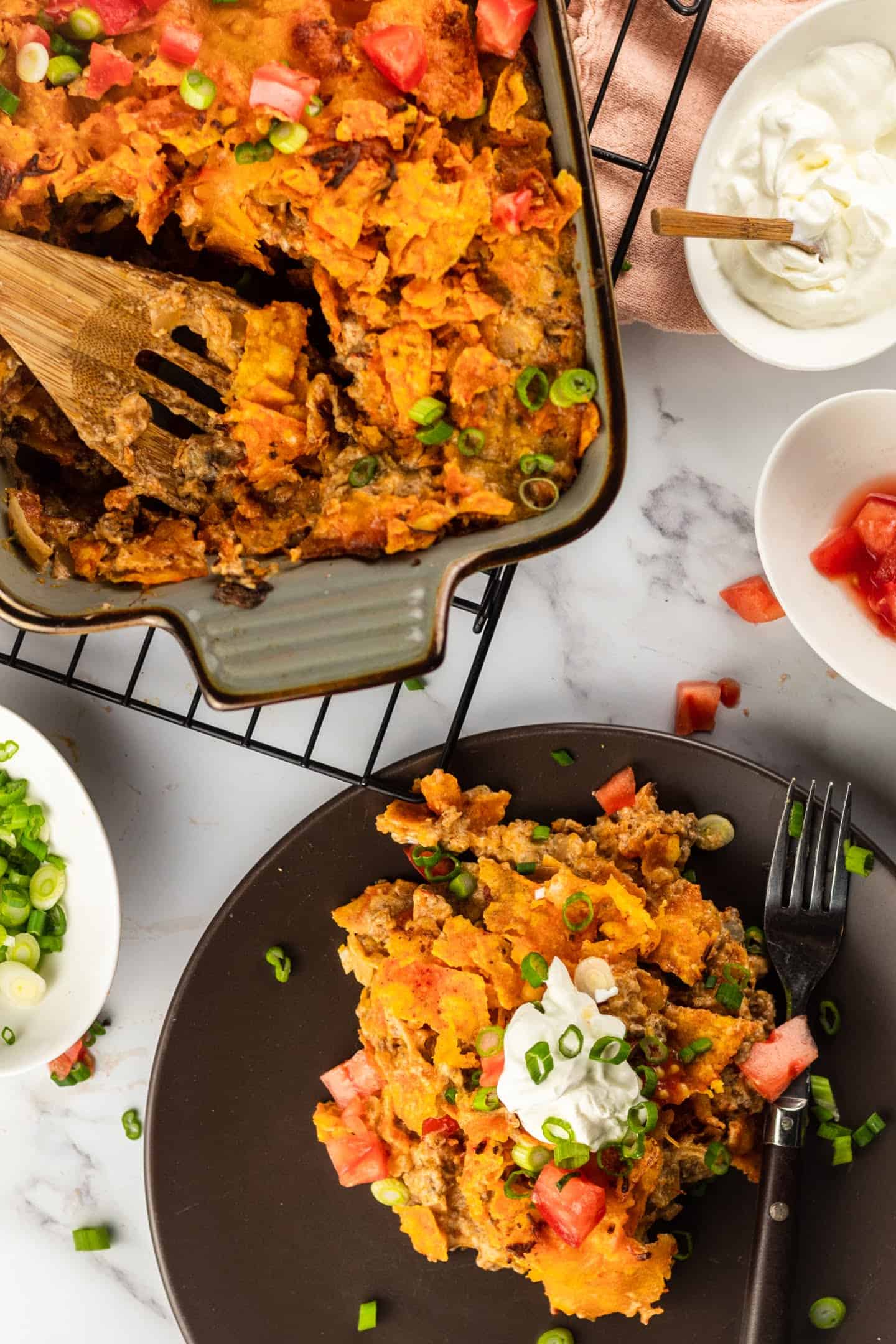 black plate with dorito casserole and ready to eat