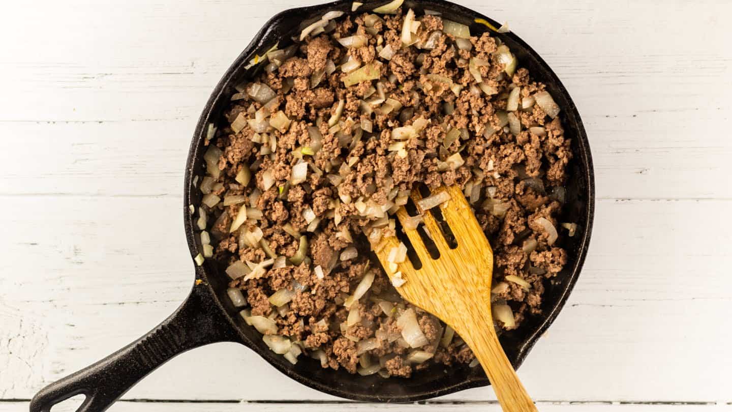 Ground beef cooking in skillet