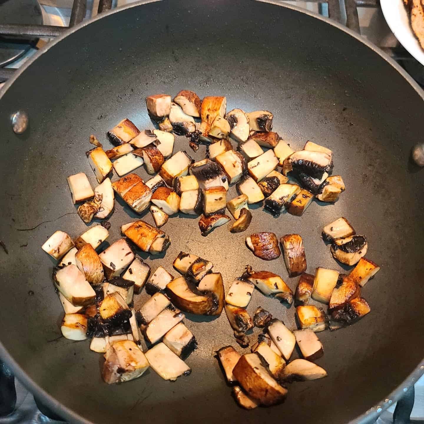 mushrooms cooking in a pan 